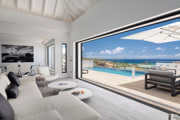 Air conditioning, HD-TV, Dish Network. The living room opens onto the terrace and the views.