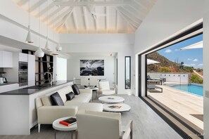 Air conditioning, HD-TV, Dish Network. The living room opens onto the terrace and the views.