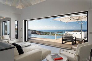 Air conditioning, HD-TV, Dish Network. The living room opens onto the terrace and the views.