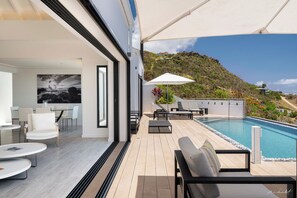 Air conditioning, HD-TV, Dish Network. The living room opens onto the terrace and the views.