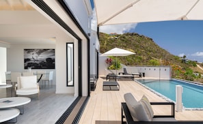 Air conditioning, HD-TV, Dish Network. The living room opens onto the terrace and the views.