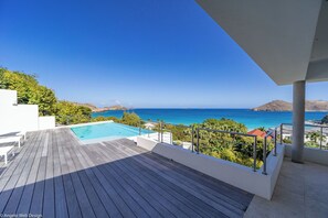 Beautiful heated pool with steps, large terrace with deckchairs.
