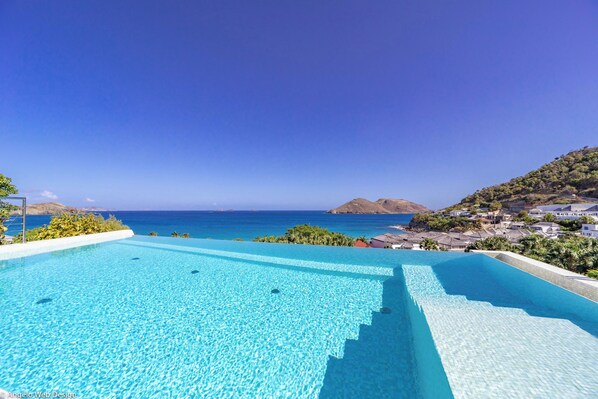 Beautiful heated pool with steps, large terrace with deckchairs.