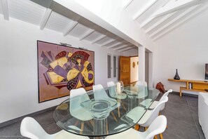 Indoor dining table in the great room. Outdoor Large dining table for 8 guests.