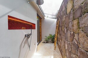 A king size bed, air conditioning, ceiling fan, HD-TV, Dish Network, safe, dressing room. Ensuite bathroom with indoor Italian shower, double sink, and WC. The bedroom opens onto the terrace and the view over the bay. 