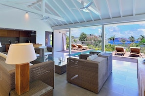 Ceiling fan, HD-TV, Dish network, Apple TV. Opens onto the terrace. Ocean view.