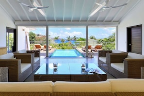 Ceiling fan, HD-TV, Dish network, Apple TV. Opens onto the terrace. Ocean view.