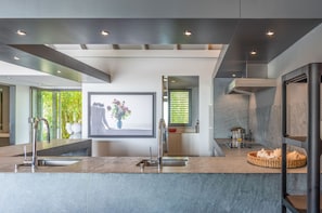 Fully equipped kitchen. Electric oven, gas stove, microwave, refrigerator, mixer, centrifuge, freezer, dishwasher, Nespresso machine, blender, kettle, toaster, breakfast bar with stools. Large dining table for 10 guests in the great room.