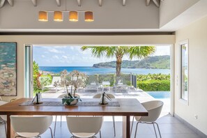 Modern, and fully equipped kitchen. Coffee machine, dishwasher, espresso machine, gas cooker, microwave oven, oven. Dining area for 6 people, facing the view. Ceiling fans. A second dining area for 6 people is located next to the great room, opening onto