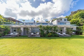 Nice tropical garden surrounding the property. Private parking at the entrance of the villa.