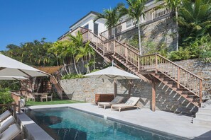 Located on a lower lowel. Nice pool, expansive terrace with loungers and deck chairs.