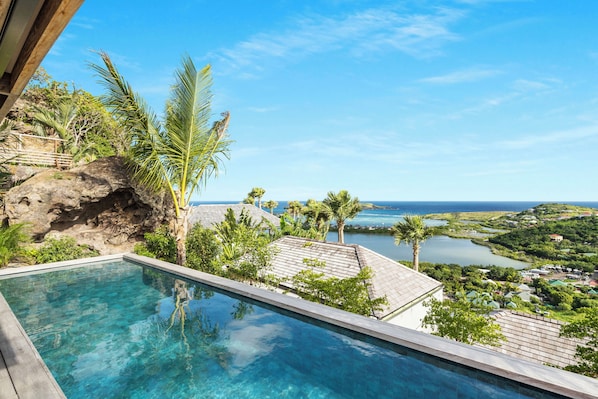 Beautiful pool facing the view. Terrace with loungers and outdoor lounge area.