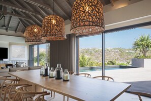 Fully equipped kitchen, air-conditioning, breakfast bar with stools, fridge, freezer, oven, microwave, dishwasher, blender, kettle, Nespresso coffee machine, toaster. Indoor large dining table for 10 guests.