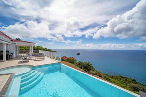 Nice heated pool, expansive terrace with loungers and deck chairs, facing the panoramic views.