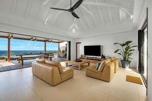 Great room with HD-TV, Apple TV, ceiling fan. Opens onto the terrace. Ocean view. 