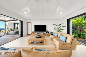 Great room with HD-TV, Apple TV, ceiling fan. Opens onto the terrace. Ocean view. 
