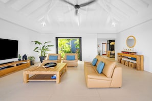 Great room with HD-TV, Apple TV, ceiling fan. Opens onto the terrace. Ocean view.