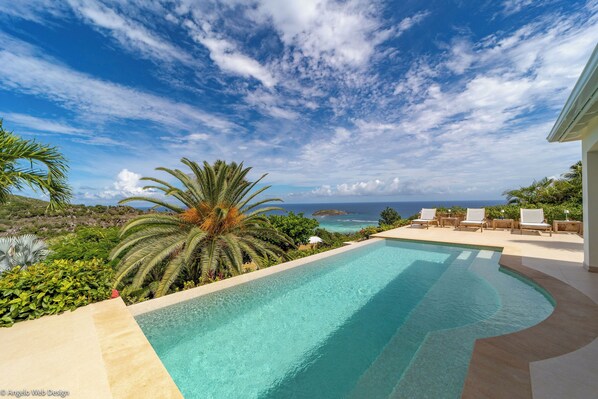 Beautiful heated pool, expansive terrace with sun loungers.