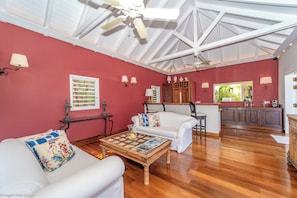 Great room with large HD-TV. Outside lounge on the covered terrace. Ocean view.