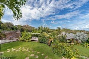 Beautiful landscaped garden of flamboyant trees, bougainvillea and palms. Private parking at the entrance.