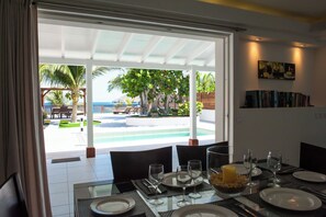 Fully equipped air-conditioned kitchen with electric oven, induction cooker, microwave, fridge and freezer, dishwasher, toaster, coffee maker, blender, electric kettle. Outdoor table on the covered terrace.