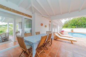 Fully equipped kitchen, ceiling fan, refrigerator with ice maker, oven, microwave, dishwasher, coffee machine, Nespresso machine. Inside dining table, and outdoor dining area on the covered terrace. 