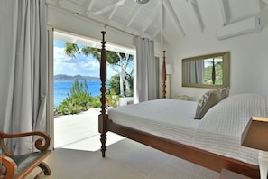 King size bed, air-conditioning, safe. Ensuite Bathroom, rain head shower, hair dryer. The bedroom opens onto a private terrace and the view.