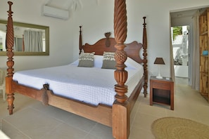 King size bed, air-conditioning, safe. Ensuite Bathroom, rain head shower, hair dryer. The bedroom opens onto a private terrace and the view.