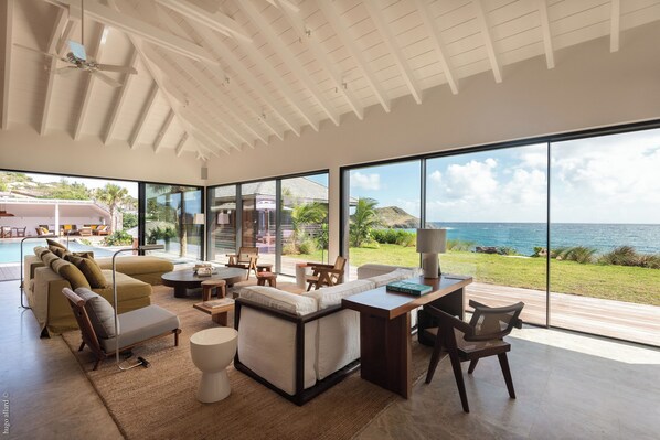 Expansive air-conditioned room opening onto the terrace and the panoramic view. 