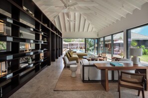 Expansive air-conditioned room opening onto the terrace and the panoramic view. 