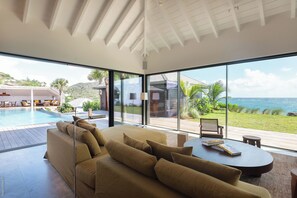 Expansive air-conditioned room opening onto the terrace and the panoramic view. 