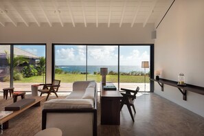 Expansive air-conditioned room opening onto the terrace and the panoramic view. 