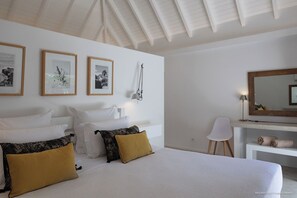 Euro King size bed, air conditioning, HD-TV, Apple TV, dressing room, programmable safe. Adjoining bathroom with shower, double basin, hair dryer, towels and beach towels.