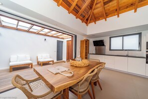 Air-conditioned kitchen equipped with electric oven, gas stove, microwave, fridge and freezer with ice maker, dish washer, toaster, regular filter coffee machine and Nespresso machine, electric kettle, blender, electric fruit squeezer. Outside dining tabl