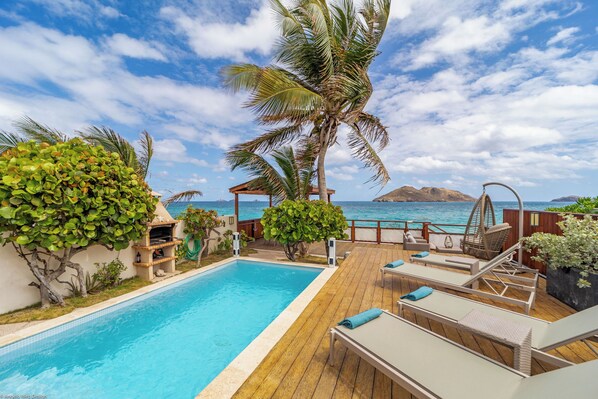 Lovely pool (about 2.5m x 5m), surrounded by a sunny deck with 4 lounge chairs.