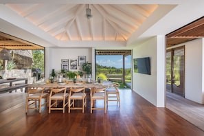 Modern and fully equipped kitchen. Coffee machine, dishwasher, espresso machine, gas cooker, microwave oven, oven, wine cellar. Dining area in the great room with a large rectangular wood table for 8-10 guests. A second dining table is available by the ba