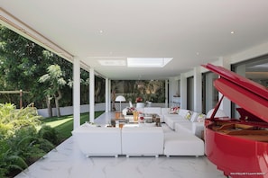 Nice lounge area on the covered terrace facing the panoramic views.