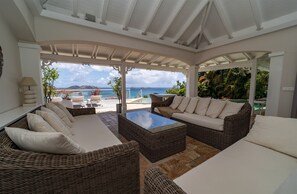 Nice lounge area on the covered terrace next to the pool. 