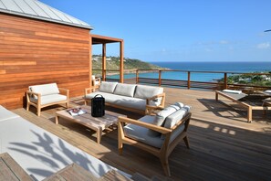 Beautiful outdoor lounge area, panoramic views over the bay. Private parking at the entrance of the property. 