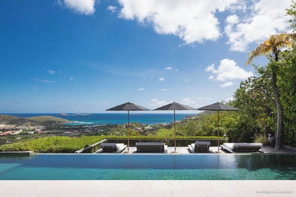 Large heated (3m x 20 m) infinity pool surrounded by a spacious sunny terrace, wooden sunbeds, magnificent views of St Jean’s bay .