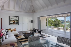 Air-conditioning, large HD-TV with Dish Network, Apple TV, Canal Satellite, iPod dock. The living room opens onto the terrace.