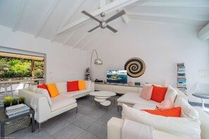 Beautiful open floor lounge area, opening directly onto the terrace and the views. HD-TV, Dish Network, ceiling fans. 
