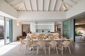 State of the art kitchen. Refrigerator, freezer, ice machine, dishwasher, oven, microwave, Nespresso machine, toaster, mixer, wine cellar.Back kitchen for private chef. Bar with stools. Professional Pizza oven. Indoor and outdoor dining areas for 10 guest