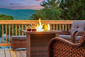 Relax by the new fire pit or unwind on the new deck furniture, all while taking in the mountain views. This serene outdoor space is perfect for making lasting memories.
