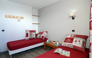 There's either 2 Single beds or Bunks in the first bedroom and Bunks + a Single bed in the second bedroom.
