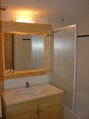 The bright bathroom is refreshing after a day of adventure.
