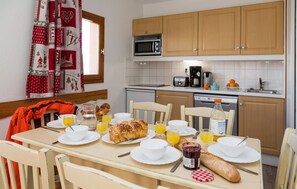 Loads of room at the dining table and the open-concept is always nice for the cook.