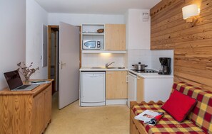 Prepare meals in the kitchenette and enjoy them at the dining table.