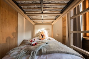 Comfy bunk bed with soft bedding, perfect for a peaceful night’s sleep.