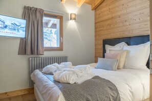 Relax on the comfy bed after a day outside.